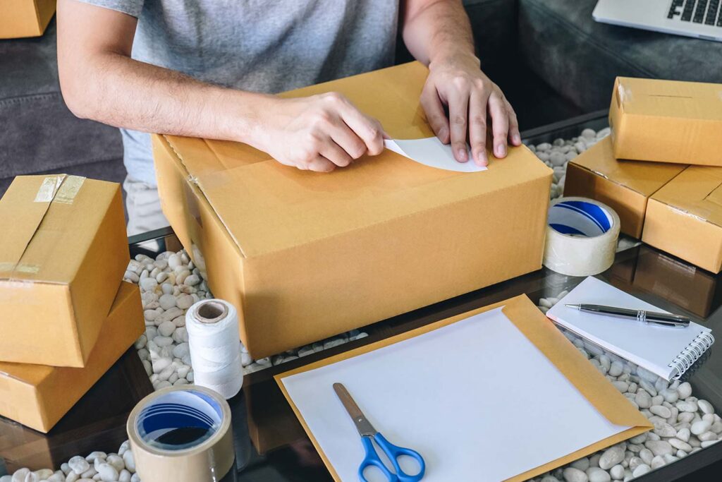 Man Preparing A Parcel For Shipping